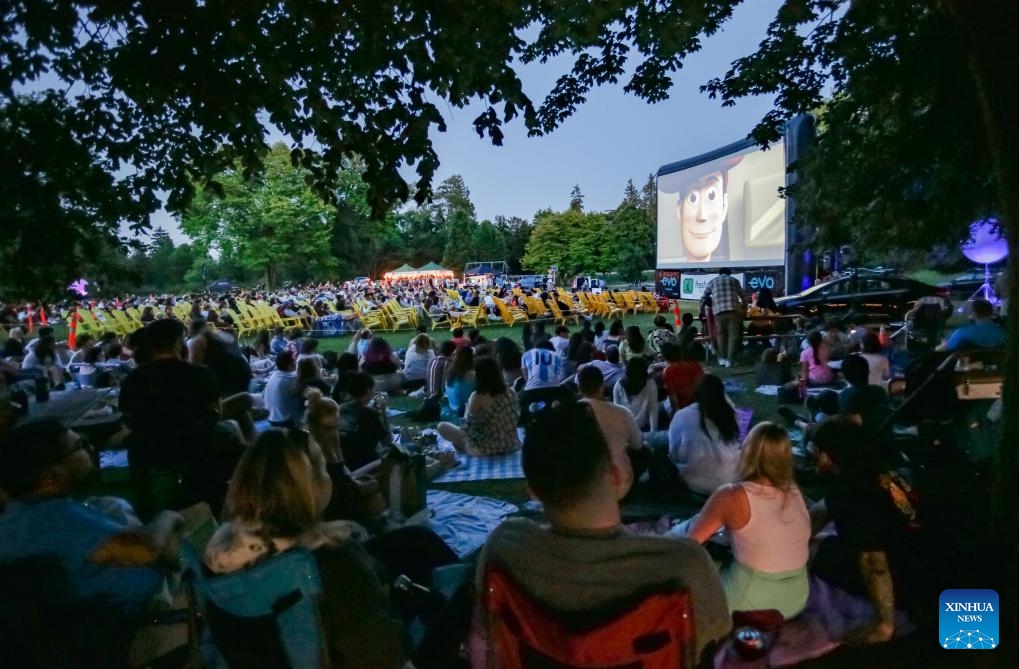 People watch a movie at an open-air cinema at Stanley Park in Vancouver, British Columbia, Canada, July 9, 2024. (Photo: Xinhua)