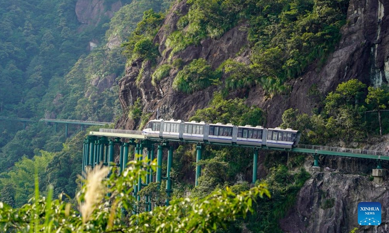 An electrical multiple unit (EMU) train moves at the Dajue Mountain Scenic Area in east China's Jiangxi Province, July 11, 2024. A batch of 30 electrical multiple unit (EMU) trains, part of what is called the mountain area elevated monorail sightseeing trains and track system, were delivered to the Dajue Mountain Scenic Area in Zixi County, east China's Jiangxi Province on Thursday. (Photo: Xinhua)