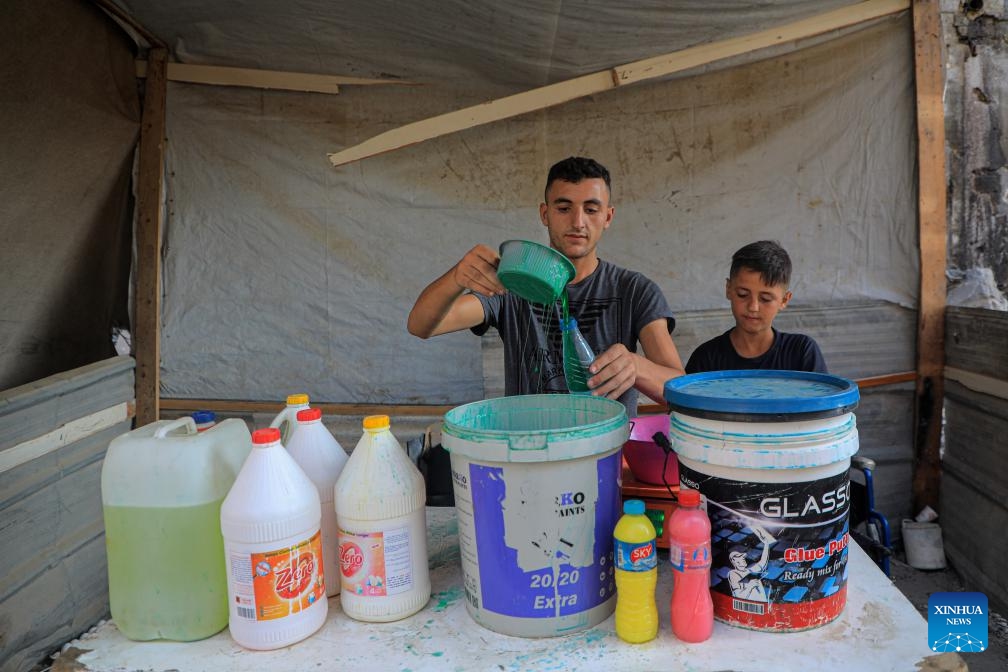 A Palestinian bottles locally produced soap in the southern Gaza Strip city of Khan Younis, on July 9, 2024. Palestinians suffer from the lack of soap and body cleansers in the markets. (Photo: Xinhua)