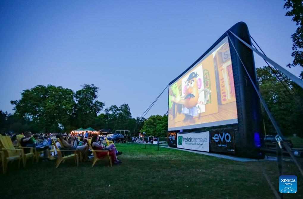 People watch a movie at an open-air cinema at Stanley Park in Vancouver, British Columbia, Canada, July 9, 2024. (Photo: Xinhua)