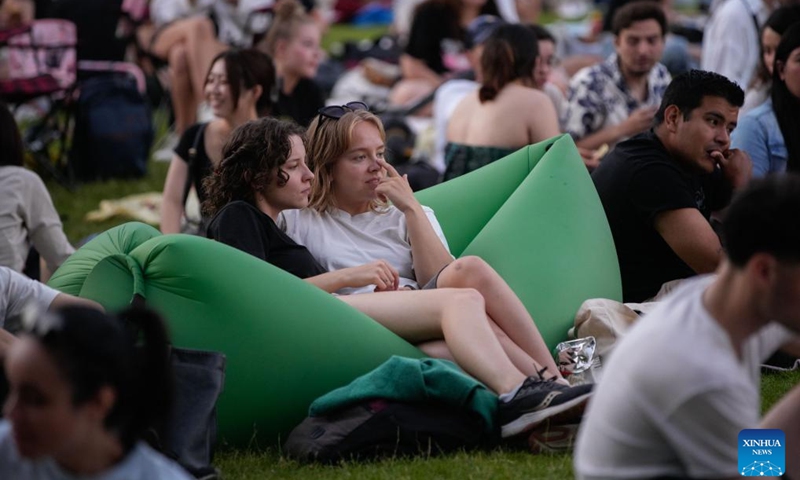 People watch a movie at an open-air cinema at Stanley Park in Vancouver, British Columbia, Canada, July 9, 2024. (Photo: Xinhua)