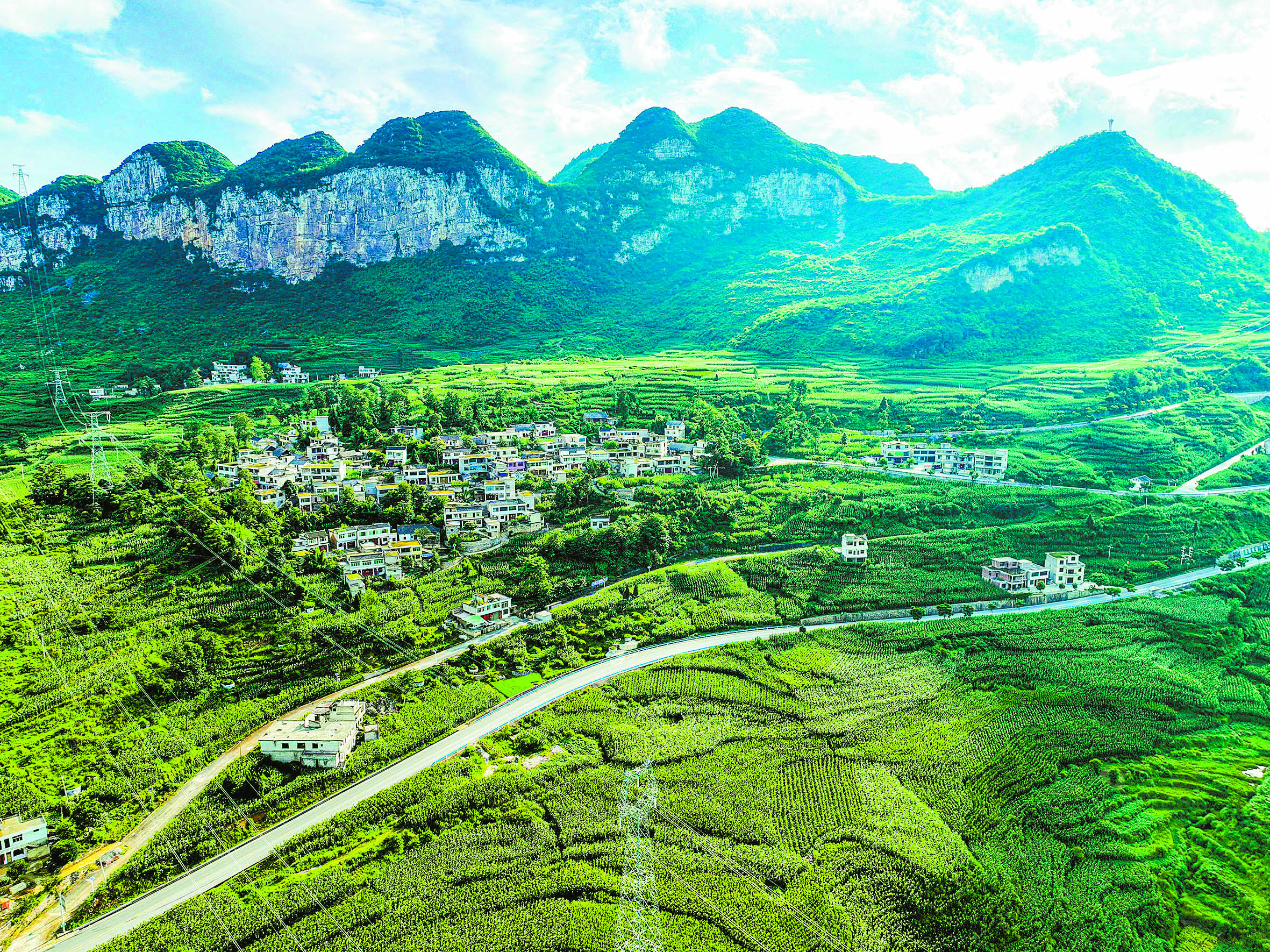 The green mountains, paddy fields, and villages of Southwest China's Guizhou Province complement and echo each other, forming a beautiful rural ecological picture, on July 10, 2024. Photo: VCG