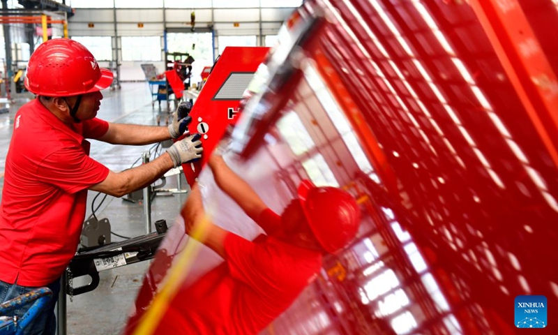 A staff member works at a factory of agricultural machinery in Da'an Town of Jining City, east China's Shandong Province, July 13, 2024. In recent years, Da'an Town has made efforts to develop the agricultural machinery industry. At present, the town is home to an industrial cluster comprising over 100 agricultural machinery-related enterprises. (Xinhua/Guo Xulei)