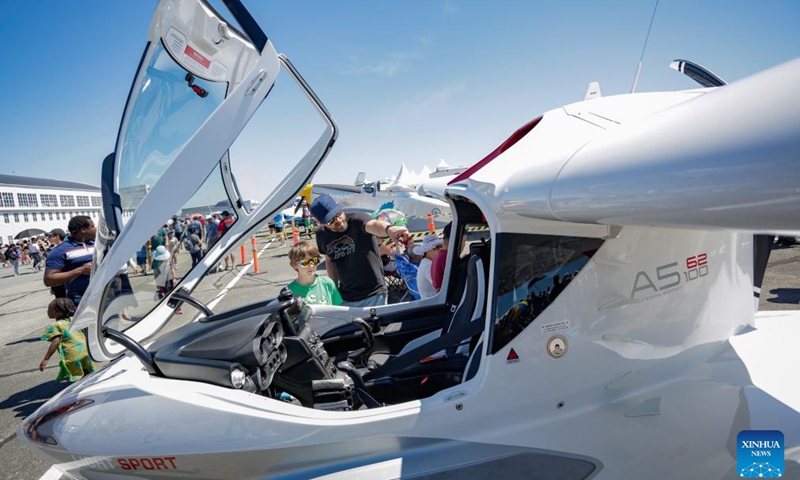 People view a light sport aircraft at the 2024 Boundary Bay Airshow in Delta, British Columbia, Canada, on July 13, 2024.This annual airshow opened here on Saturday, featuring aerobatic performances and static displays of both modern and vintage airplanes. (Photo by Liang Sen/Xinhua)