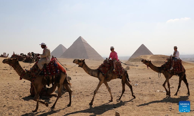 Tourists visit the Giza Pyramids scenic spot in Giza, Egypt, on July 14, 2024. Tourism revenue of Egypt hit 6.6 billion U.S. dollars in the first half of 2024, surpassing the 6.3 billion dollars during the same period in 2023. (Xinhua/Wang Dongzhen)