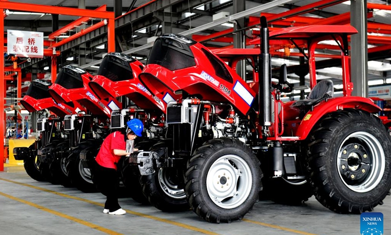 A staff member works at a factory of agricultural machinery in Da'an Town of Jining City, east China's Shandong Province, July 13, 2024. In recent years, Da'an Town has made efforts to develop the agricultural machinery industry. At present, the town is home to an industrial cluster comprising over 100 agricultural machinery-related enterprises. (Xinhua/Guo Xulei)