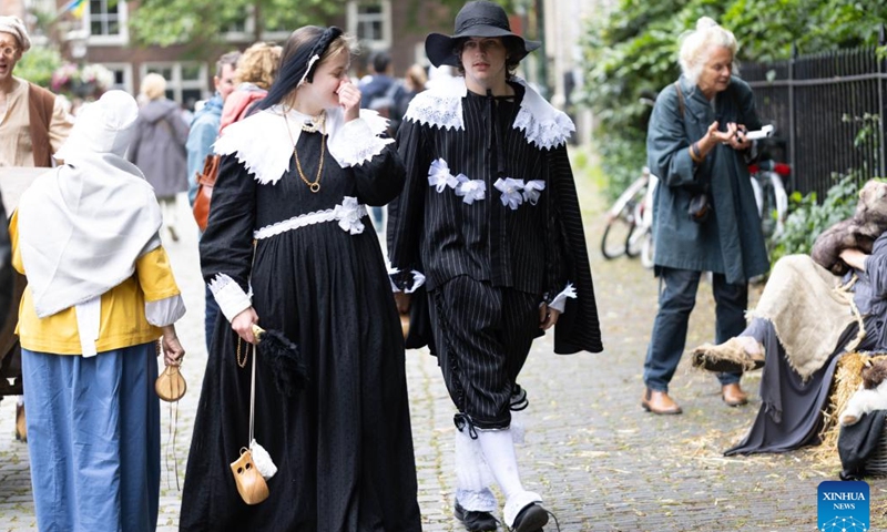 People are dressed in vintage clothing in celebration of the Rembrandt Days in Leiden, the Netherlands, July 13, 2024.