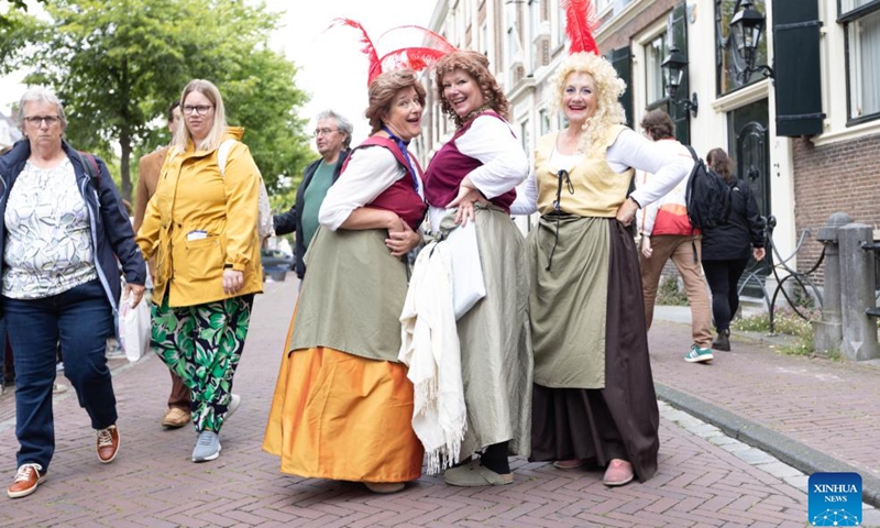 People are dressed in vintage clothing in celebration of the Rembrandt Days in Leiden, the Netherlands, July 13, 2024.