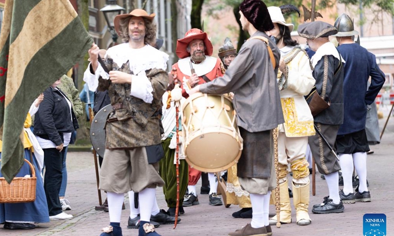 People are dressed in vintage clothing in celebration of the Rembrandt Days in Leiden, the Netherlands, July 13, 2024.