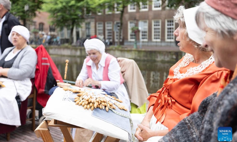 People are dressed in vintage clothing in celebration of the Rembrandt Days in Leiden, the Netherlands, July 13, 2024.