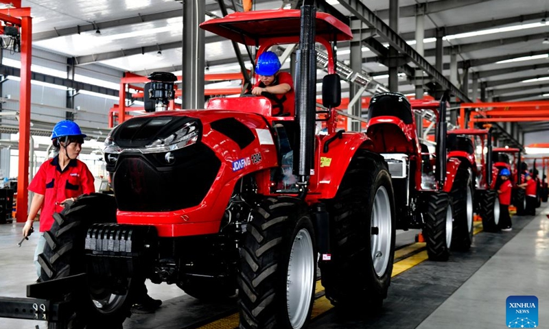 Staff members work at a factory of agricultural machinery in Da'an Town of Jining City, east China's Shandong Province, July 13, 2024. In recent years, Da'an Town has made efforts to develop the agricultural machinery industry. At present, the town is home to an industrial cluster comprising over 100 agricultural machinery-related enterprises. (Xinhua/Guo Xulei)