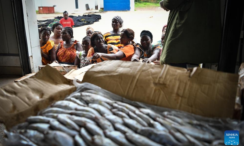 Local residents and dealers purchase aquatic products at a Chinese-built aquatic products processing and storage complex in Bissau, Guinea-Bissau, on July 8, 2024.