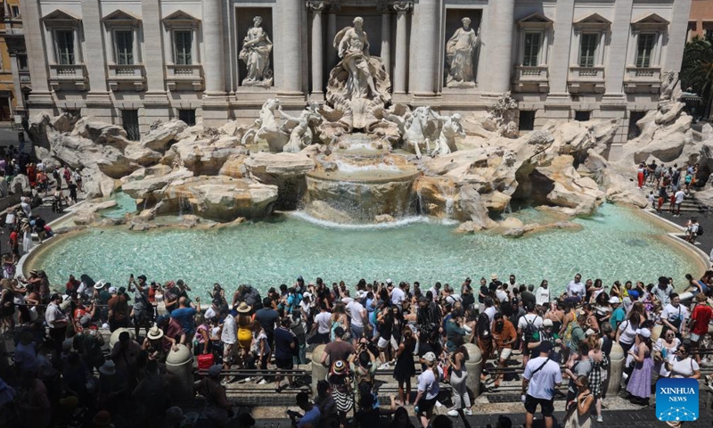 Tourists visit the Trevi Fountain amid a heatwave in Rome, Italy, July 14, 2024. (Xinhua/Li Jing)