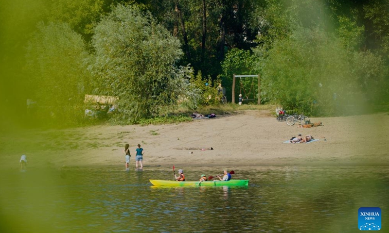 Kayakers paddle on the Vistula River in Warsaw, Poland, July 14, 2024. (Photo by Jaap Arriens/Xinhua)