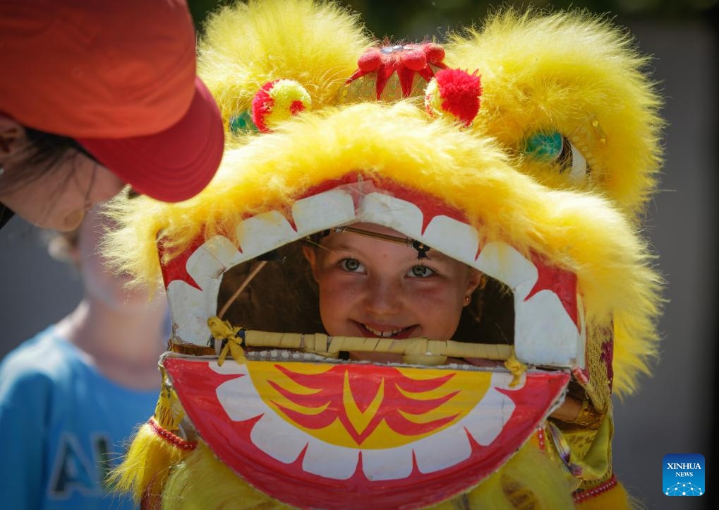 A girl attends a lion dance workshop during the 2024 Chinatown Festival in Vancouver, British Columbia, Canada, July 14, 2024. (Photo: Xinhua)