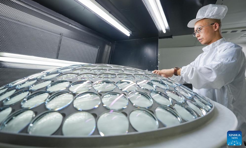 A worker checks glasses at a glasses company in Danyang City, east China's Jiangsu Province, July 16, 2024. Dubbed as China's spectacles city, Danyang has more than 1,600 companies engaged in the eyewear industry. To maintain its market share and keep up with the new market demand, eyewear companies in Danyang have attached more importance to innovation and branding in recent years and a whole industrial chain has taken shape. (Photo: Xinhua)