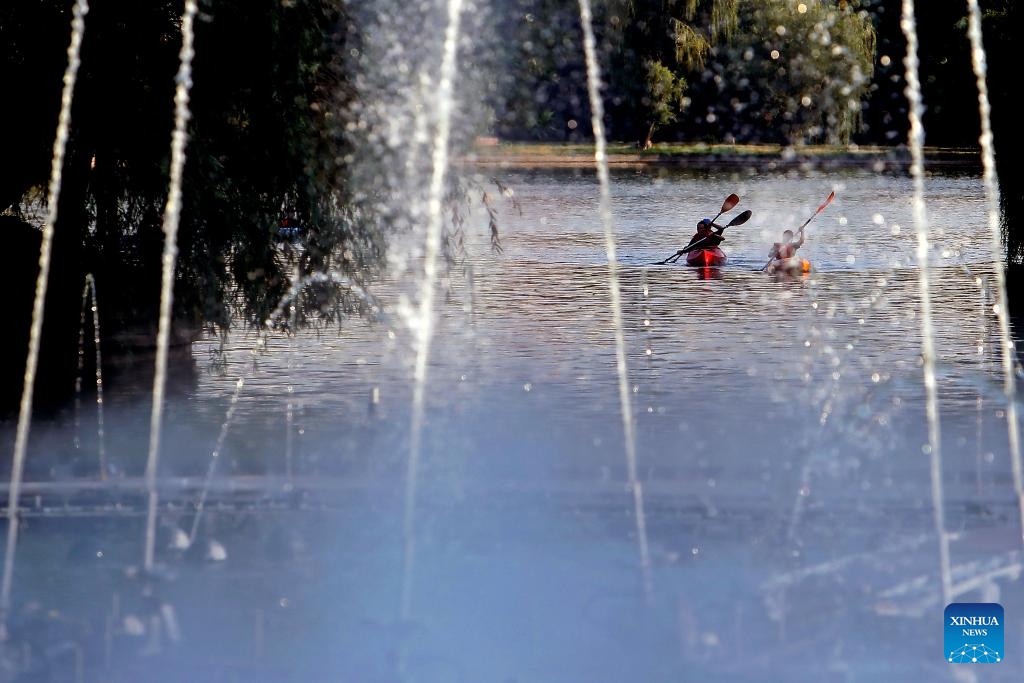 People enjoy canoeing at a park in Bucharest, Romania, on July 17, 2024. The Romanian National Meteorological Administration (ANM) has extended its red and orange heat warnings until Wednesday, affecting the entire country amid an ongoing heatwave. (Photo: Xinhua)