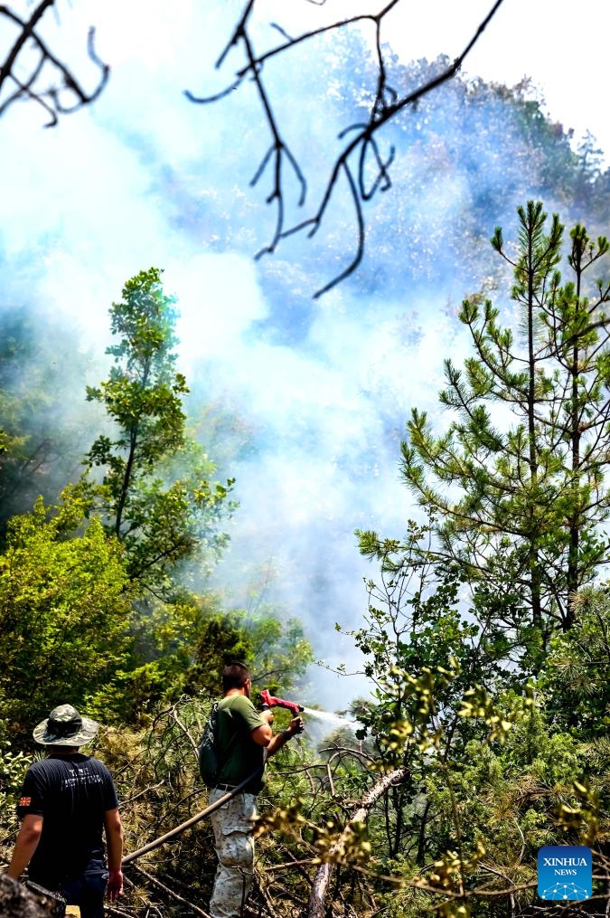 Firefighters work to put out a fire in the Serta mountain near Negotino, North Macedonia on July 16, 2024. (Photo: Xinhua)