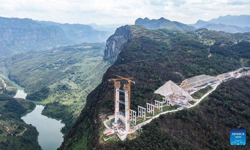 This aerial drone photo taken on July 17, 2024 shows the Tianmen grand bridge in construction in southwest China's Guizhou Province. The 1,553-meter grand bridge is a major project on the expressway linking Anshun and Panzhou in Guizhou. (Photo: Xinhua)