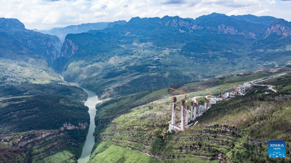 This aerial drone photo taken on July 17, 2024 shows the Tianmen grand bridge in construction in southwest China's Guizhou Province. The 1,553-meter grand bridge is a major project on the expressway linking Anshun and Panzhou in Guizhou. (Photo: Xinhua)