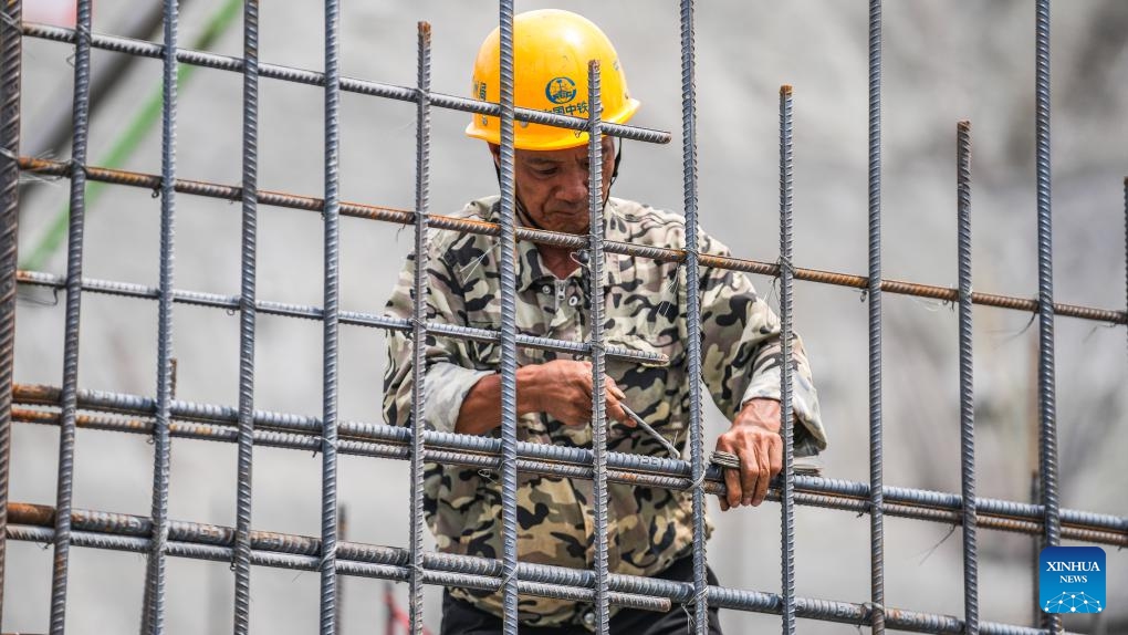 A worker works at the construction site of the Tianmen grand bridge in southwest China's Guizhou Province, July 17, 2024. The 1,553-meter grand bridge is a major project on the expressway linking Anshun and Panzhou in Guizhou. (Photo: Xinhua)