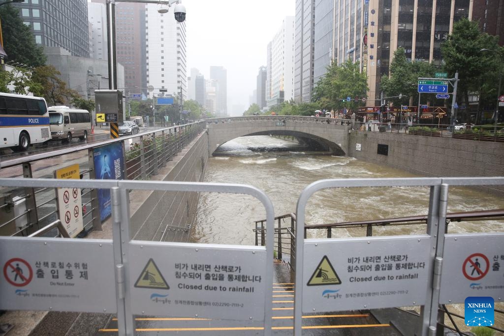 The sidewalk along Cheonggyecheon Stream is closed due to continuous rainfall in Seoul, South Korea on July 18, 2024. Seoul has seen continuous rainfall in the past few days. (Photo: Xinhua)