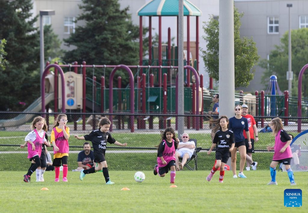 Children compete at a soccer training class during summer vacation in Toronto, Canada, on July 17, 2024. (Photo: Xinhua)