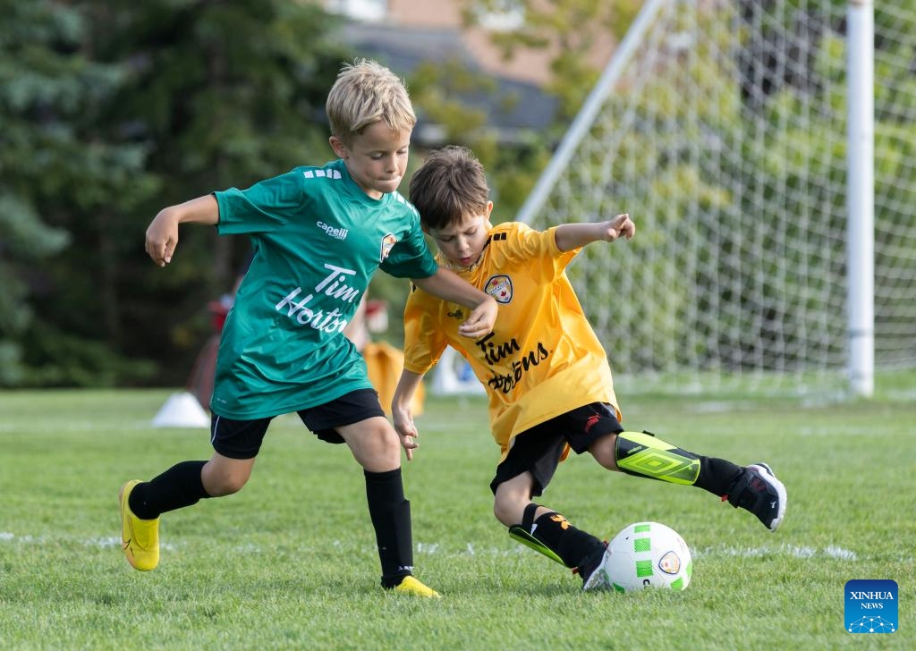 Children compete at a soccer training class during summer vacation in Toronto, Canada, on July 17, 2024. (Photo: Xinhua)