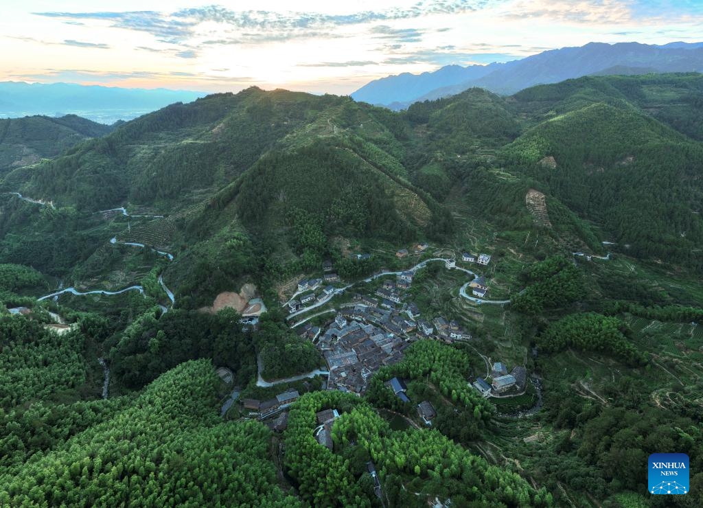 An aerial drone photo taken on July 17, 2024 shows a view of Songzhuang Village in Songyang County, east China's Zhejiang Province. Nestled in the mountains, Songzhuang Village of Songyang County boasts a history of over 600 years and preserves many traditional residences. In recent years, local government has renovated old houses and ancient paths and introduced new business forms to attract young talents to start their businesses there.(Photo: Xinhua)