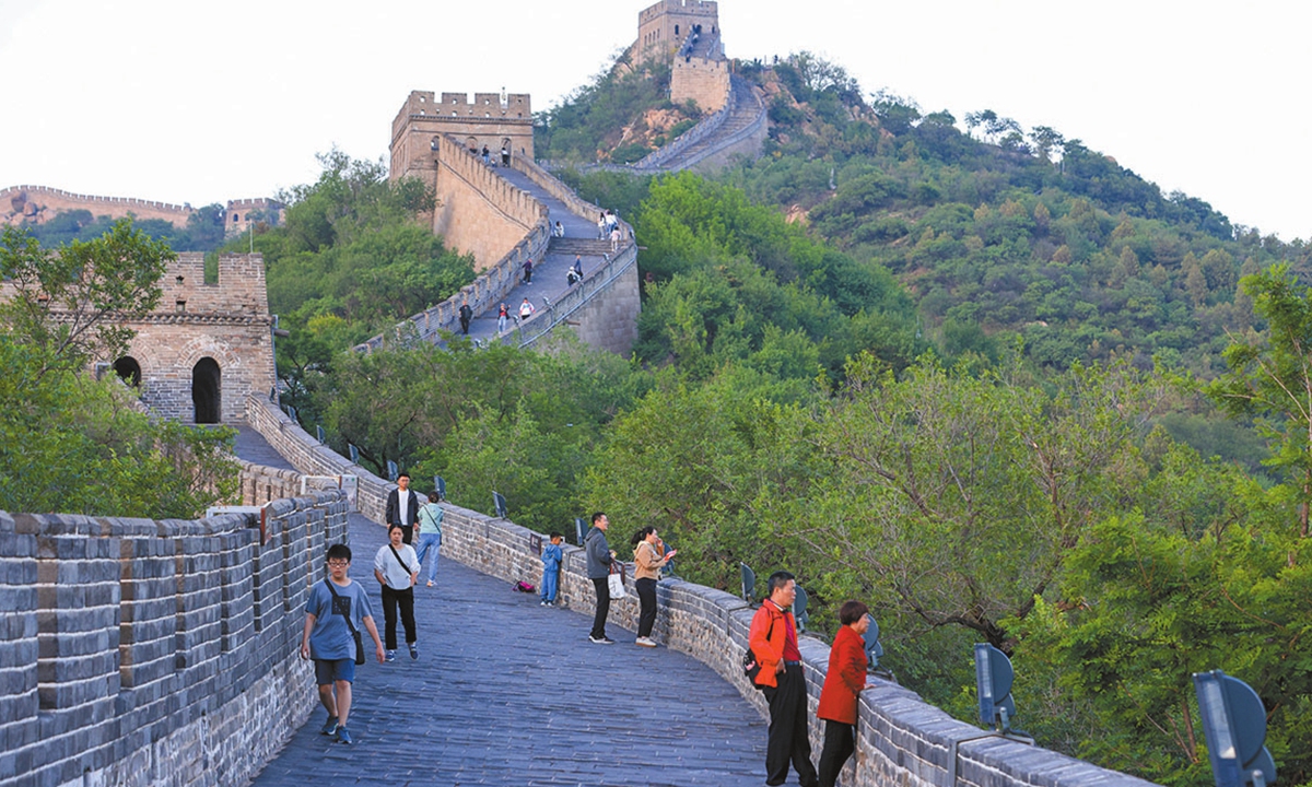 Tourists enjoy themselves in Beijing. Photo: VCG