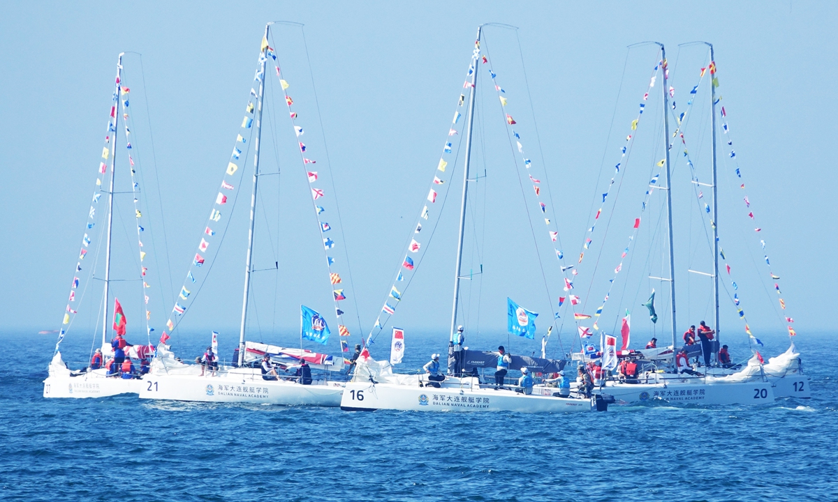 Teams from various countries sail their boats to the designated sea area to compete during the first Navy Cup International Sailing Regatta in Dalian, Northeast China's Liaoning Province on July 21, 2024. Sailing teams from naval academies and schools representing China and eight other countries including Brazil, Italy, Iran and Russia will compete during the four-day event.Photo: VCG