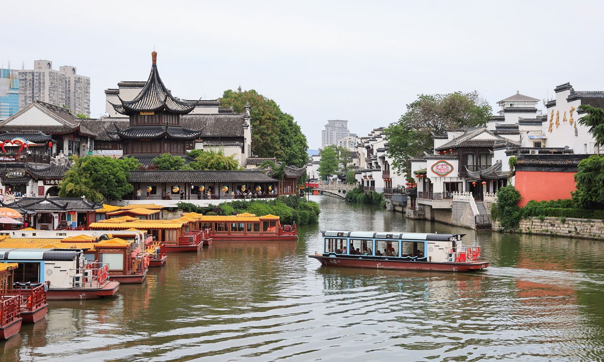 Tourists enjoy themselves in Nanjing. Photo: VCG