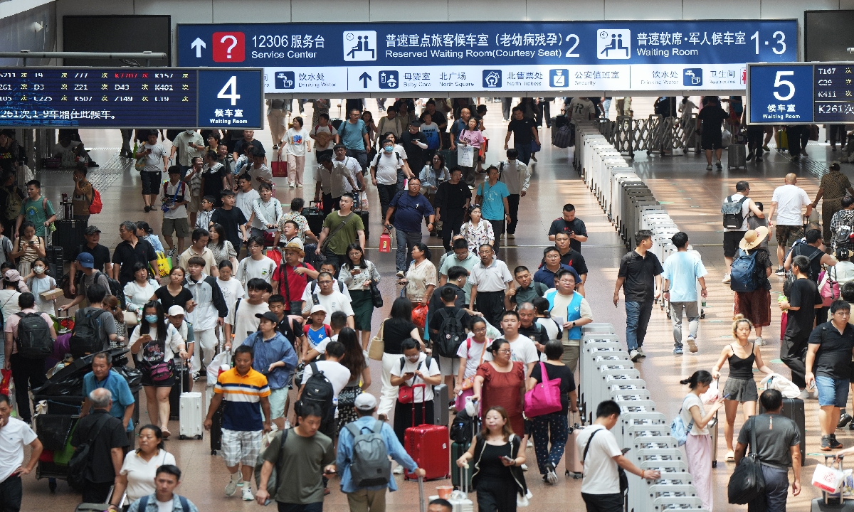 Passengers gather at the Beijing West Railway Station on July 23, 2024. From July 1, when the summer rush started, to July 22, trains carried 307 million passengers, data from the China State Railway Group Co showed. The company said the figure was an increase of 6.5 percent from the same period last year. Photo: VCG