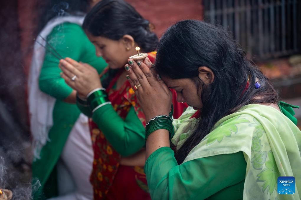 Devotees pray on the first Monday of the holy month of Shrawan in Lalitpur, Nepal, on July 22, 2024. (Photo: Xinhua)