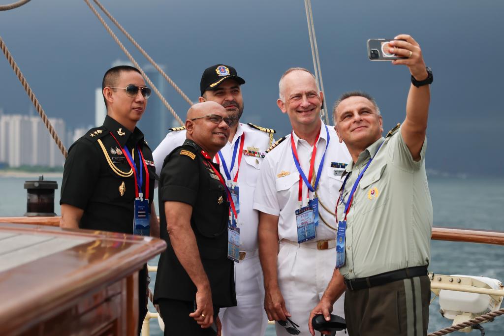 Military attachés pose for a selfie aboard a training vessel of the Chinese People's Liberation Army (PLA) Navy, July 22, 2024. (Photo: Xinhua)