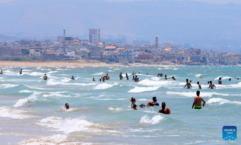 People have fun at a beach in Tyre, Lebanon, July 21, 2024. (Photo: Xinhua)