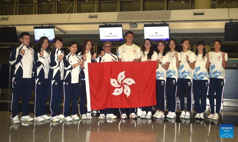 Members of the delegation of China's Hong Kong pose for photos before the departure for Paris 2024 Olympic Games at the Hong Kong International Airport in Hong Kong, south China, July 22, 2024. (Xinhua/Lo Ping Fai)