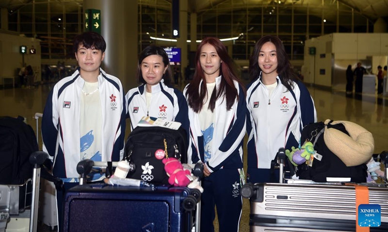 Athletes Doo Hoi Kem, Lee Ho Ching, Zhu Chengzhu and Ng Wing Lam (L to R) of the delegation of China's Hong Kong pose for photos before the departure for Paris 2024 Olympic Games at the Hong Kong International Airport in Hong Kong, south China, July 22, 2024. (Xinhua/Lo Ping Fai)