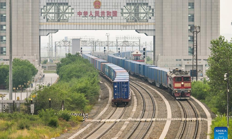 A drone photo taken on July 17, 2024 shows two China-Europe freight trains running through the Manzhouli railway port in Manzhouli, north China's Inner Mongolia Autonomous Region. According to statistics from Manzhouli Customs, in the first six months of 2024, the Manzhouli railway port has handled 2,327 China-Europe freight train trips. (Photo: Xinhua)