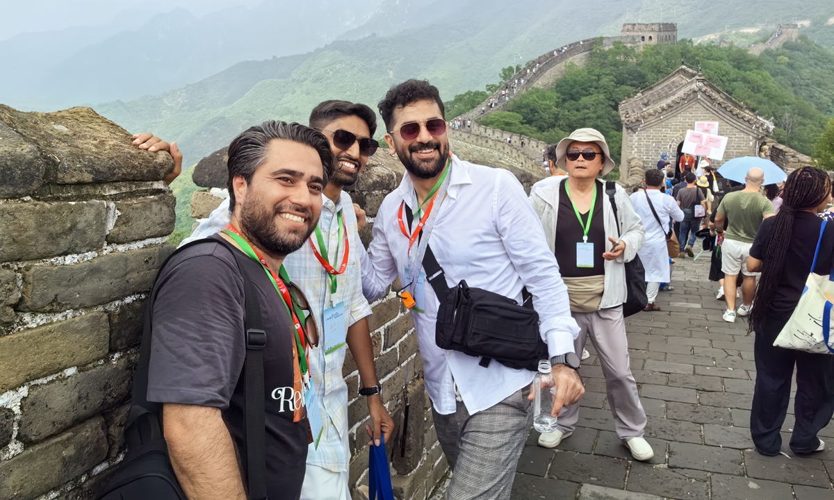 Foreign poets pose for a photo at the Mutianyu section of the Great Wall in Beijing on July 23, 2024. Photo: Dong Feng/GT