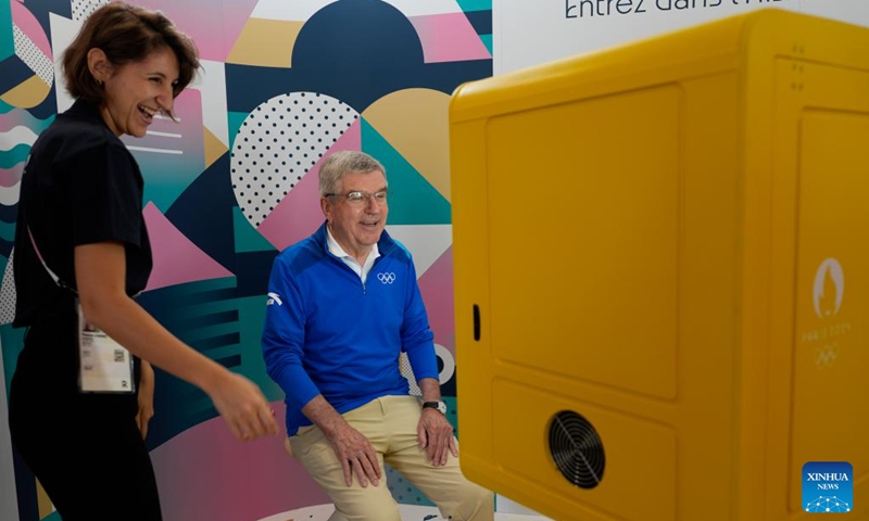 IOC President Thomas Bach (R) tours the Olympic Village ahead of the Paris 2024 Olympic Games, on July 22, 2024, in Paris, France. (Photo by David Goldman/POOL/Xinhua)