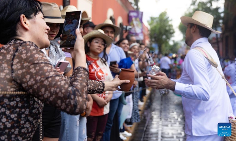 People take part in Guelaguetza in Oaxaca City, Mexico, July 20, 2024. Guelaguetza is an annual showcase of the indigenous cultures of Mexico, featured by traditional music, dance, and food. (Photo: Xinhua)