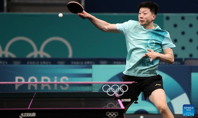 Ma Long of the Chinese national table tennis team hits a return during a training session for Paris 2024 in South Paris Arena, Paris, France, July 22, 2024. (Xinhua/Wang Dongzhen)