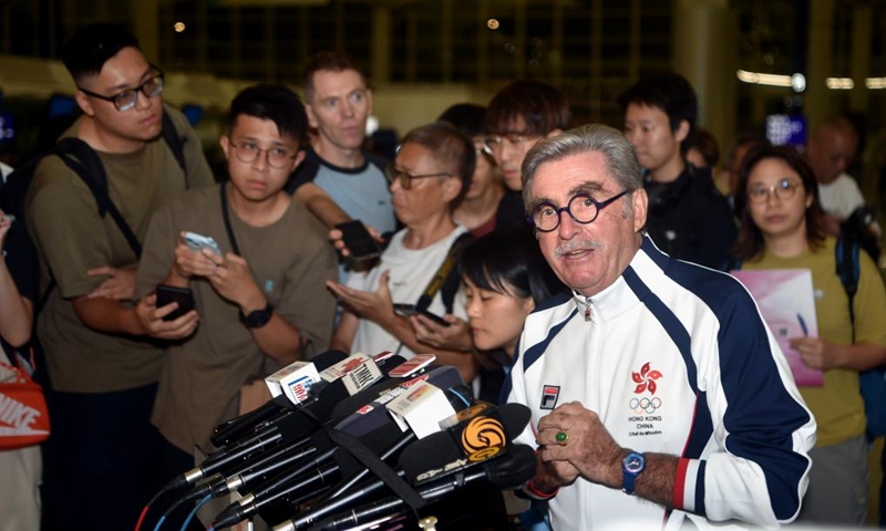 Thomas Brian Stevenson, head of the delegation of China's Hong Kong, gets interviewed before the departure for Paris 2024 Olympic Games at the Hong Kong International Airport in Hong Kong, south China, July 22, 2024. (Xinhua/Lo Ping Fai)