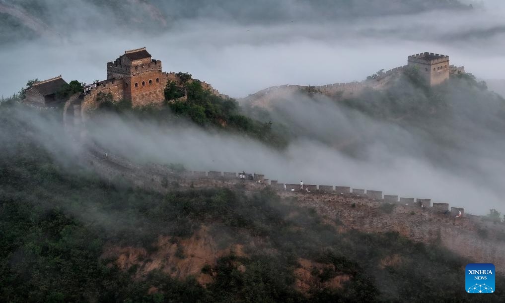 An aerial drone photo taken on June 30, 2024 shows a view of the Jinshanling section of the Great Wall in Luanping County, Chengde City, north China's Hebei Province. Chengde, a popular summer tourism destination approximately 230 km north of the Chinese capital Beijing, is an important transportation hub in north China. The city with profound cultural heritage is a place where nomadic culture, farming culture, royal culture and folk culture blend together. (Photo: Xinhua)