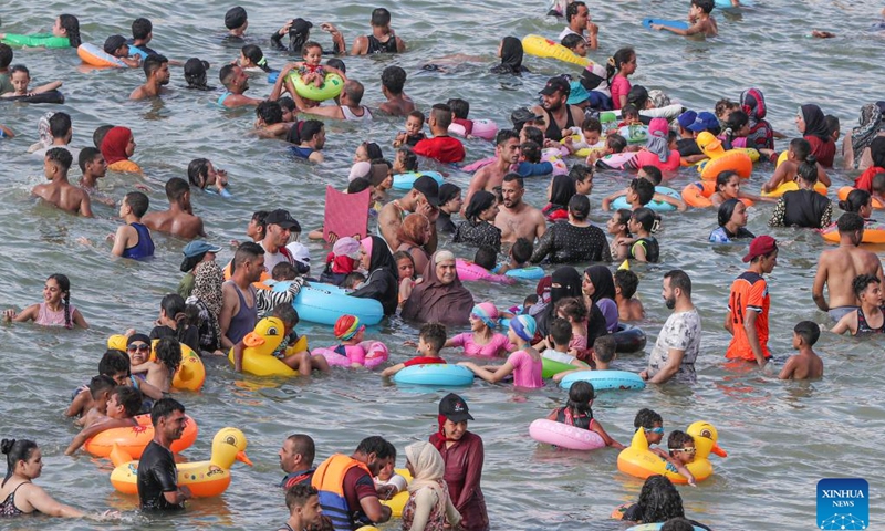 People cool off at a beach of the Mediterranean Sea during a heatwave in Alexandria, Egypt, on July 23, 2024. (Photo: Xinhua)