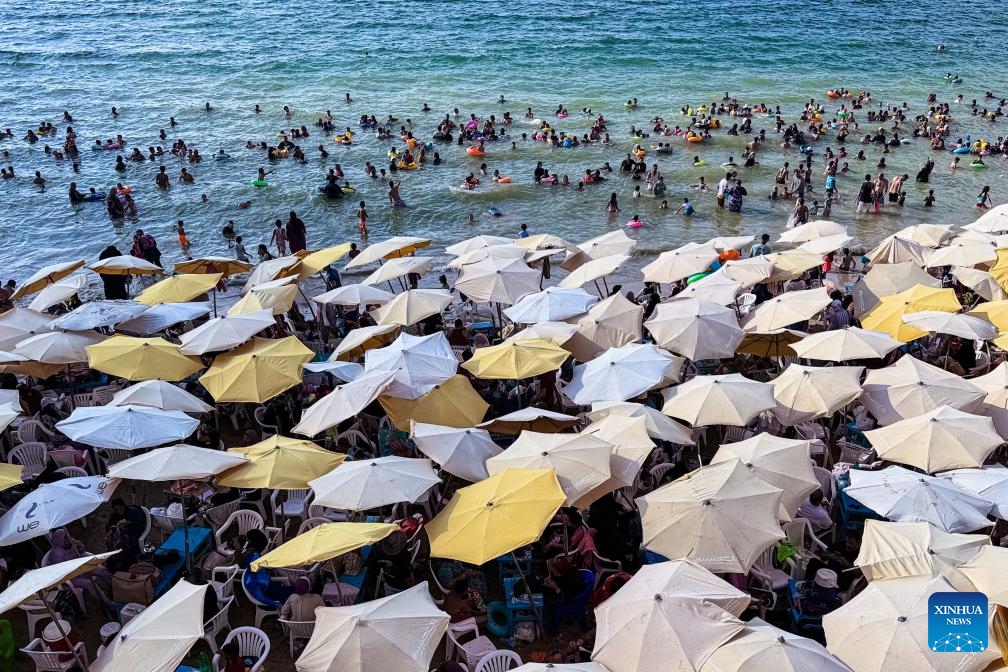 People cool off at a beach of the Mediterranean Sea during a heatwave in Alexandria, Egypt, on July 23, 2024. (Photo: Xinhua)