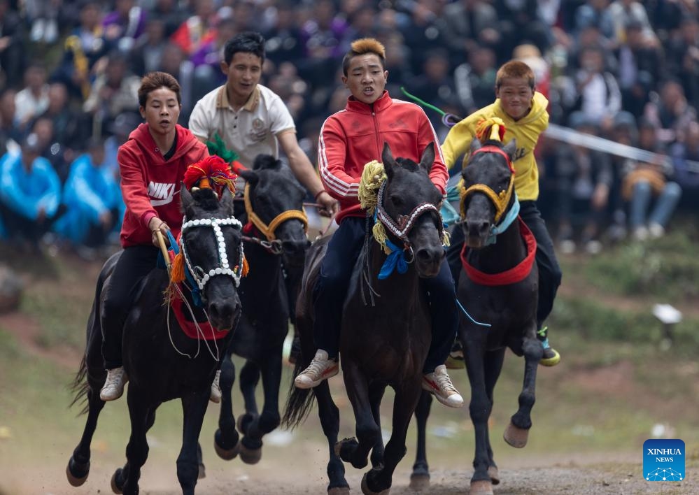 People race horses during a torch festival in Eliping Township, Butuo County, southwest China's Sichuan Province, July 21, 2024. From July 21 to 23, a traditional torch festival of Yi ethnic group was held in Butuo County. People participated in various folk sports events such as horse racing, sheepfighting, bullfighting and wrestling during the festival. (Photo: Xinhua)