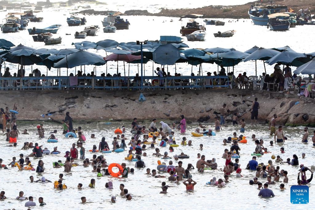 People cool off at a beach of the Mediterranean Sea during a heatwave in Alexandria, Egypt, on July 23, 2024. (Photo: Xinhua)