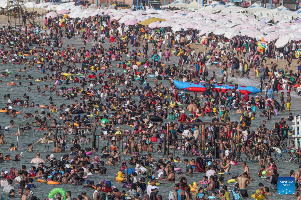 People cool off at a beach of the Mediterranean Sea during a heatwave in Alexandria, Egypt, on July 23, 2024. (Photo: Xinhua)